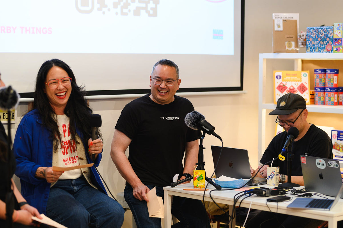 Photo of the creator during a live taping of a podcast episode