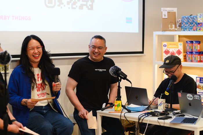 Photo of the creator during a live taping of a podcast episode
