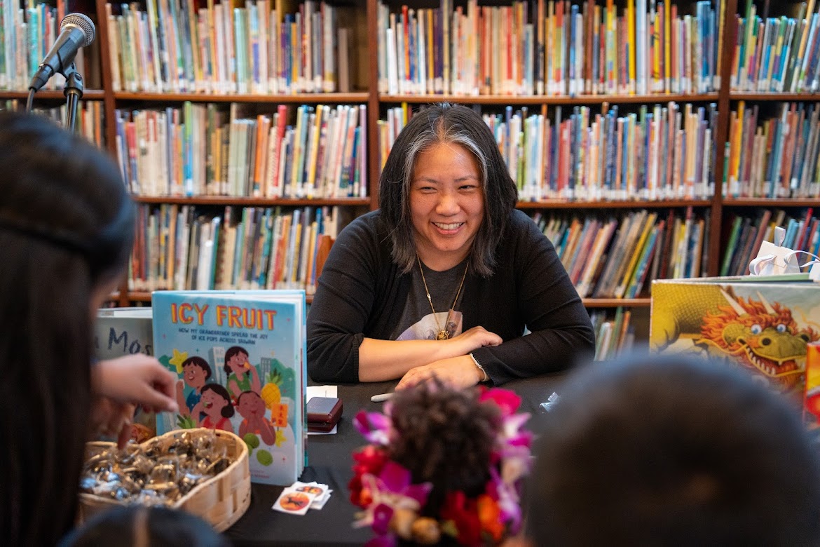 Image of author tabling at an event